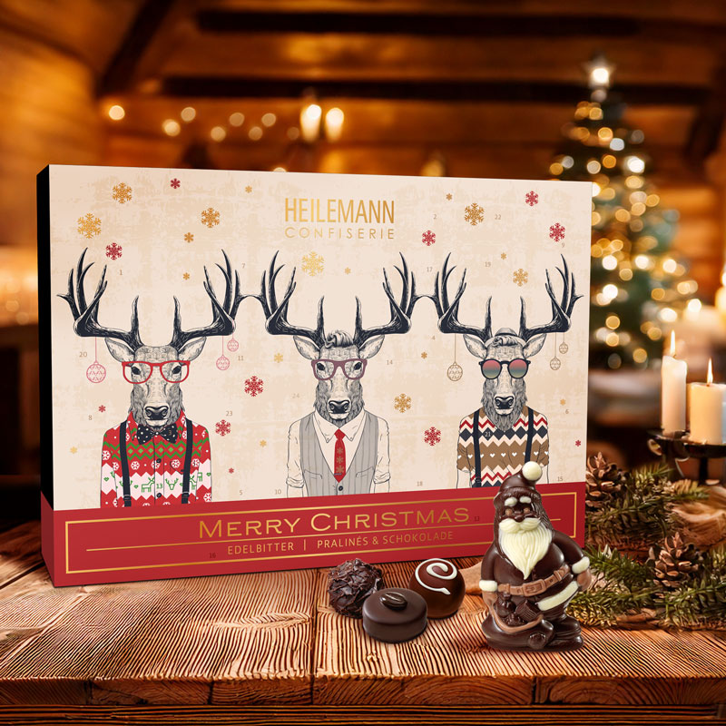 Heilemann Adventskalender Edelbitter-Pralinen vor dem Kamin